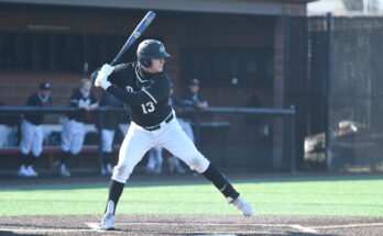 Fifth-year senior Ryan Krout batting at home field
